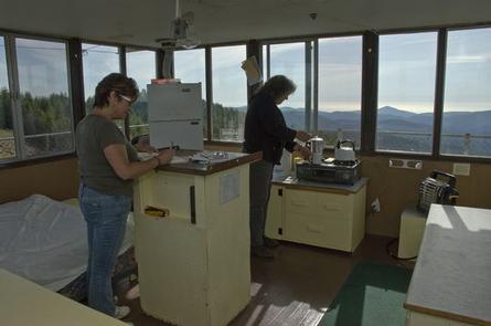 two people inside lookout tower.