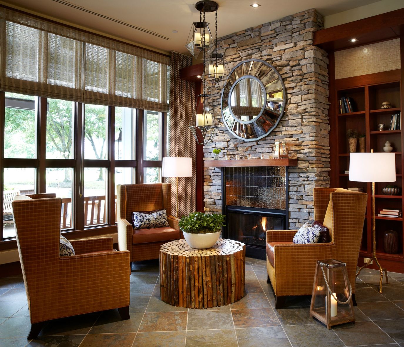 hotel lobby with structured wicker chairs near fireplace