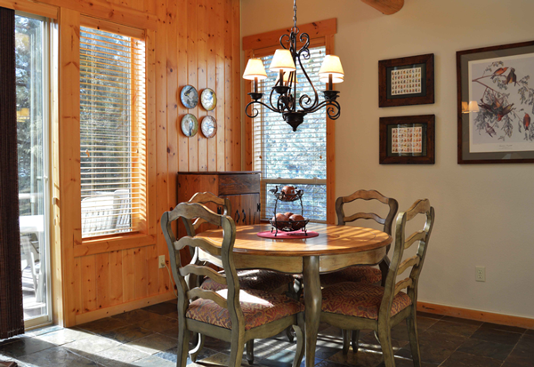 wooden table and chairs with country chic chandelier over table