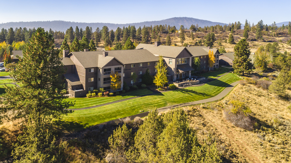 aerial image of motel story hotel resort surrounded by trees