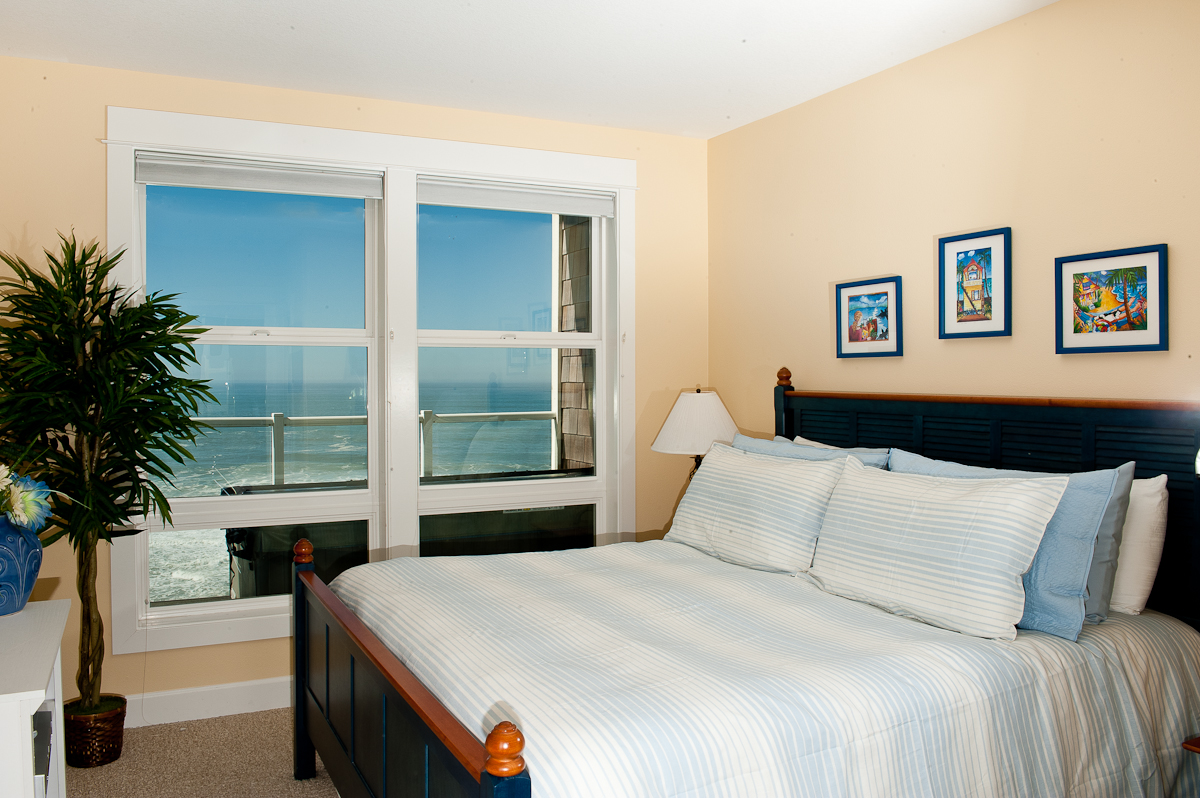 guest room of vacation rental with double bed and window with a water view