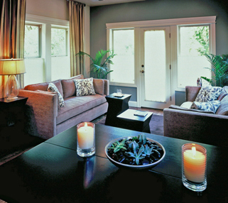 interior of guest suite with two couches and door to patio