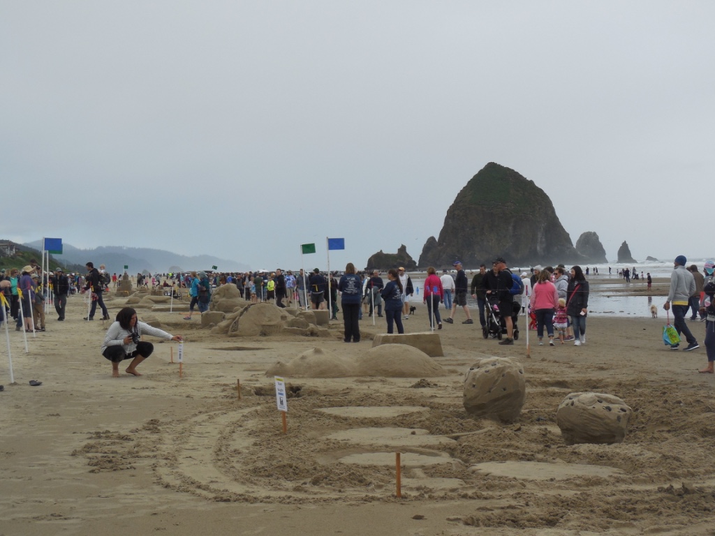 sand castle contest in front of haystack rock