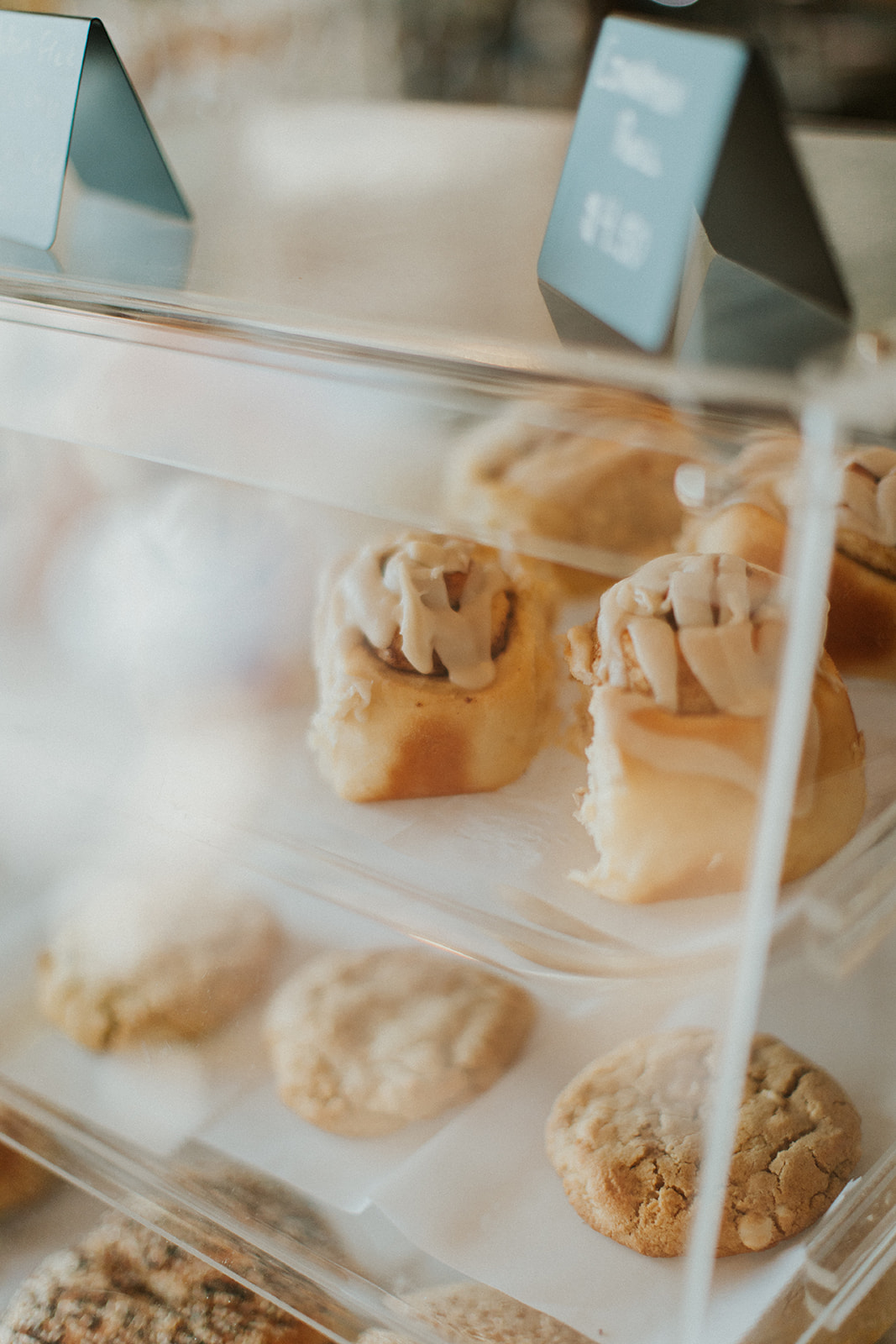 Cinnamon rolls and cookies in a plastic pastry case at Golden Coffee in Prineville, Oregon
