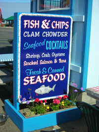 sign outside of seafood restaurant with menu items