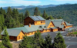 exterior of mountain lodge and parking lot