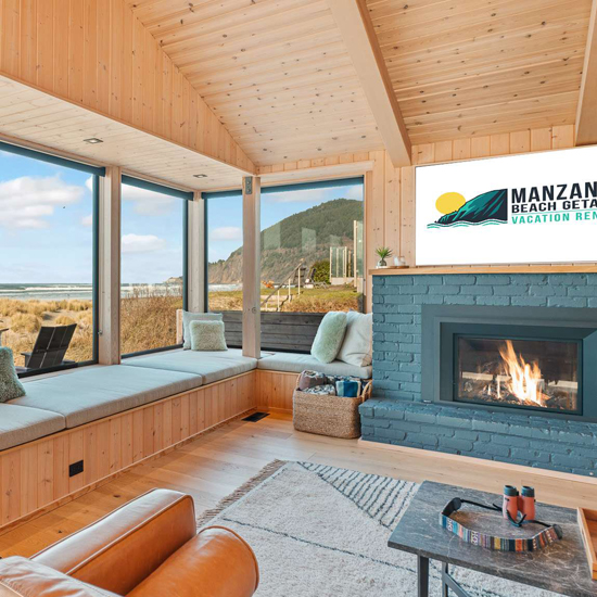 living room of beach vacation rental with brick fireplace and view of ocean