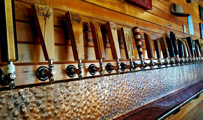taps on wall of bar