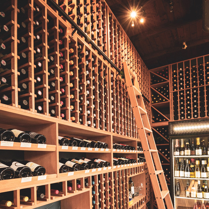 wall of wine bottle storage with ladder