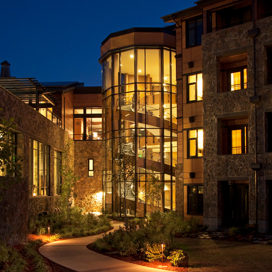 illuminated spiral staircase of hotel resort taken from outside