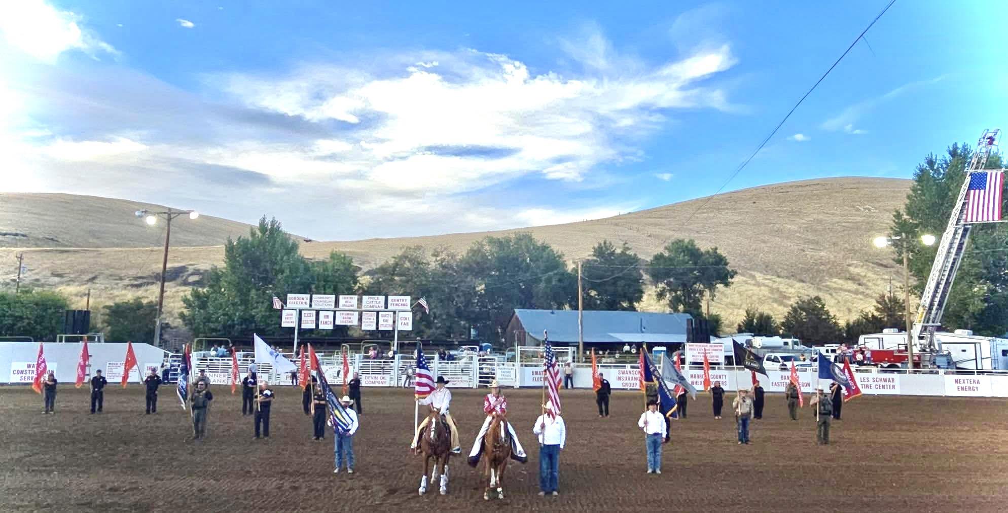 flag bearers and horses in position at opening of Morrow County Rodeo
