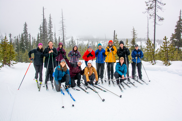 group of cross country skiers pose for photo