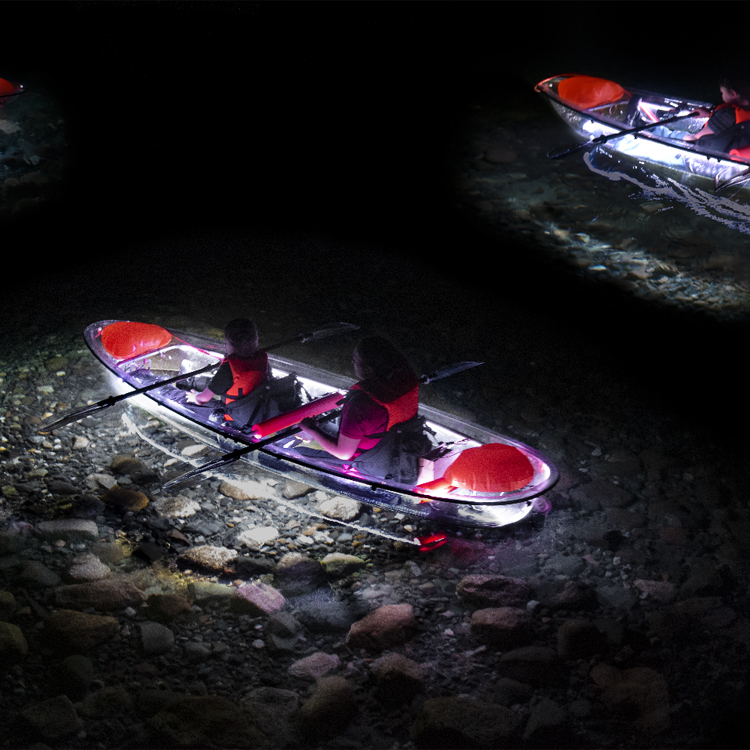 two people in translucent  kayak that is lit with LED lights
