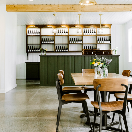 winery tasting room with modern table and chairs and bar