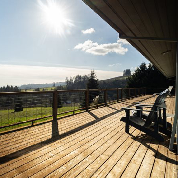 patio with two chairs and view of rural landscape
