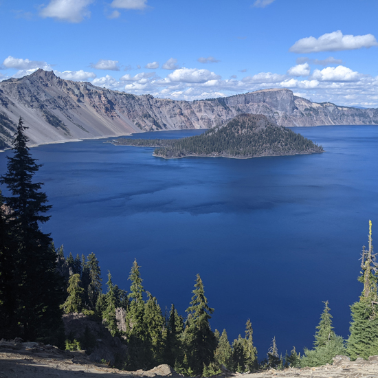 crater lake and blue sky with clouds