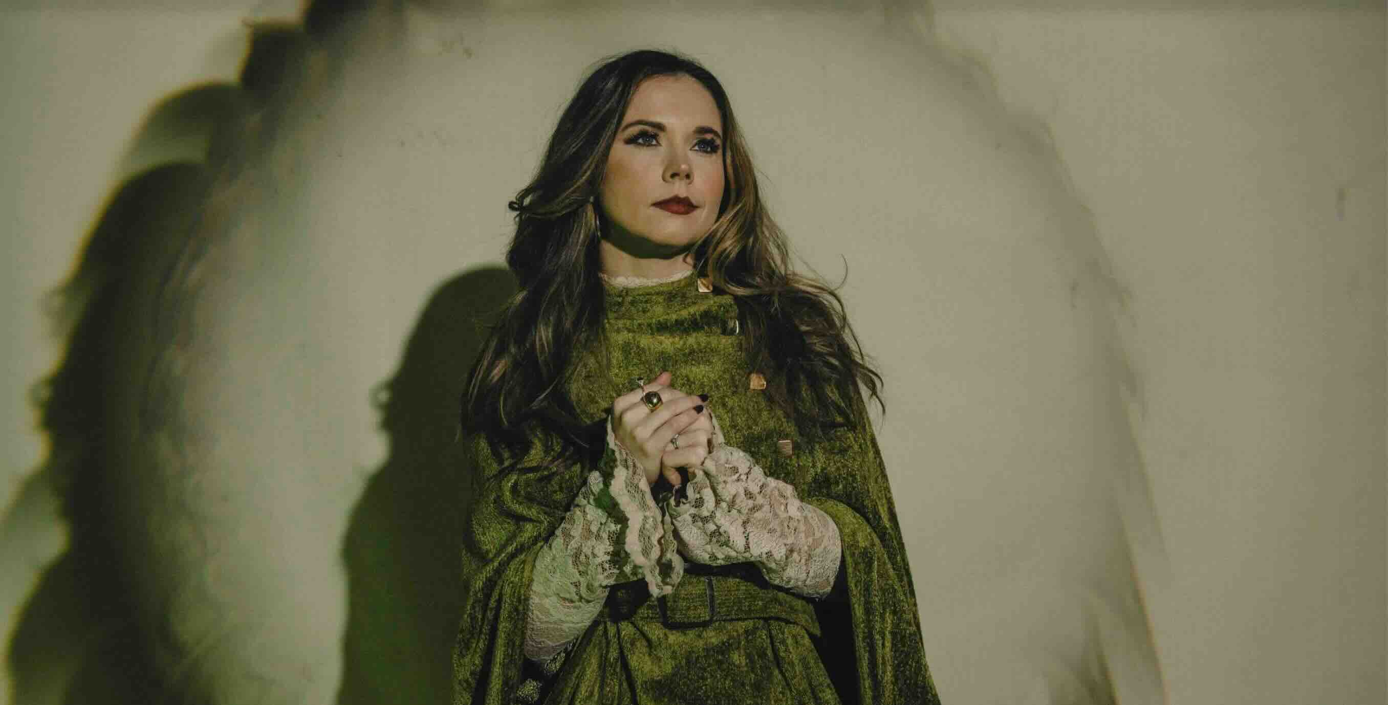 musician Sierra Hull clasps hands in front of torso