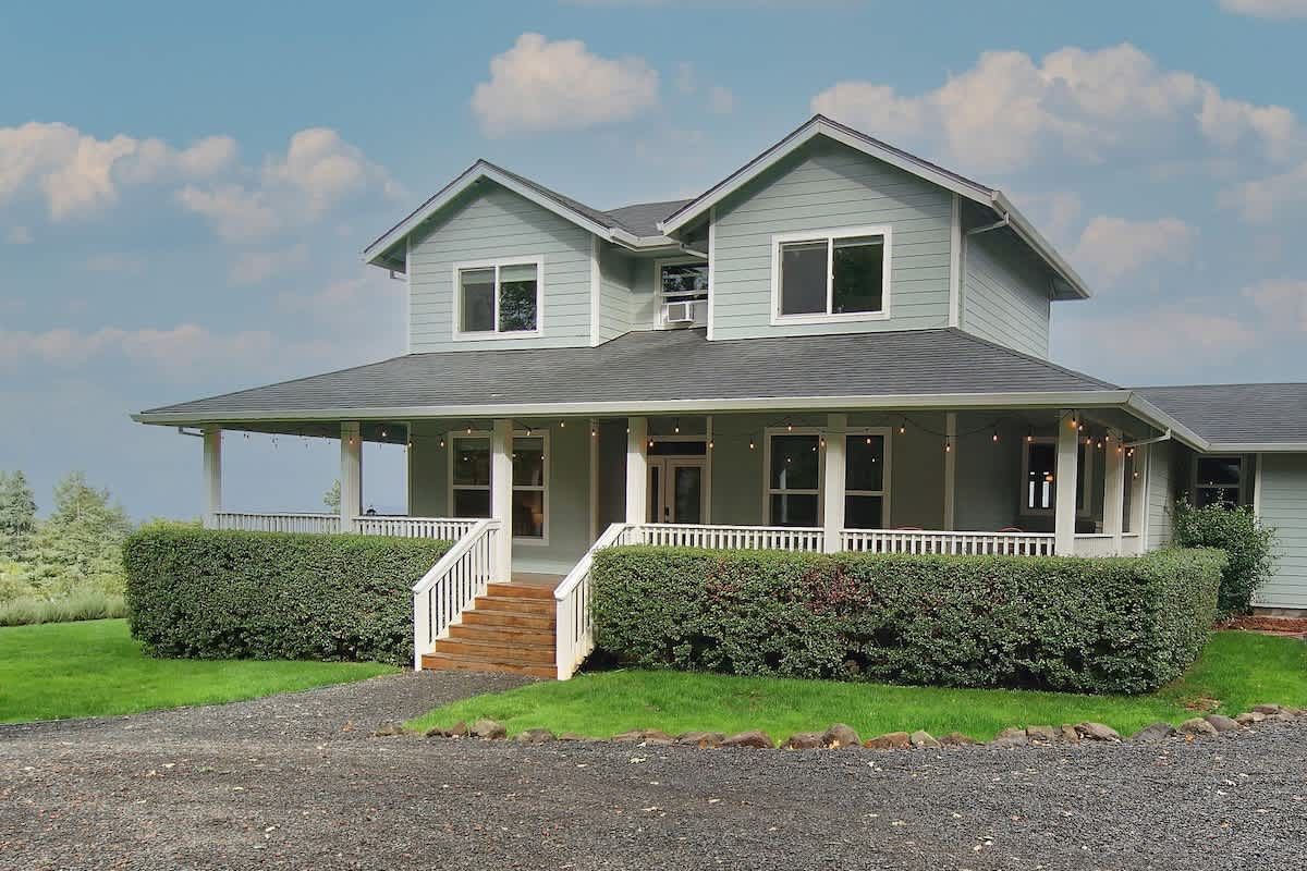 two story farmhouse with large porch