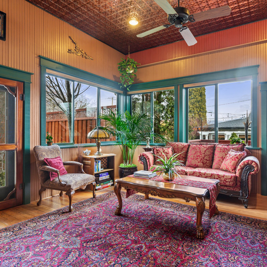 sitting area of hotel lobby with tin ceiling detail