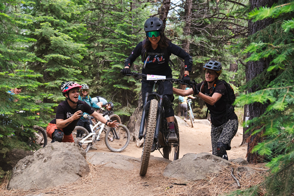 group of women riders on mountain bike trail
