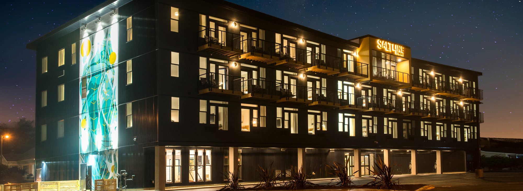 exterior shot of four story hotel taken at night