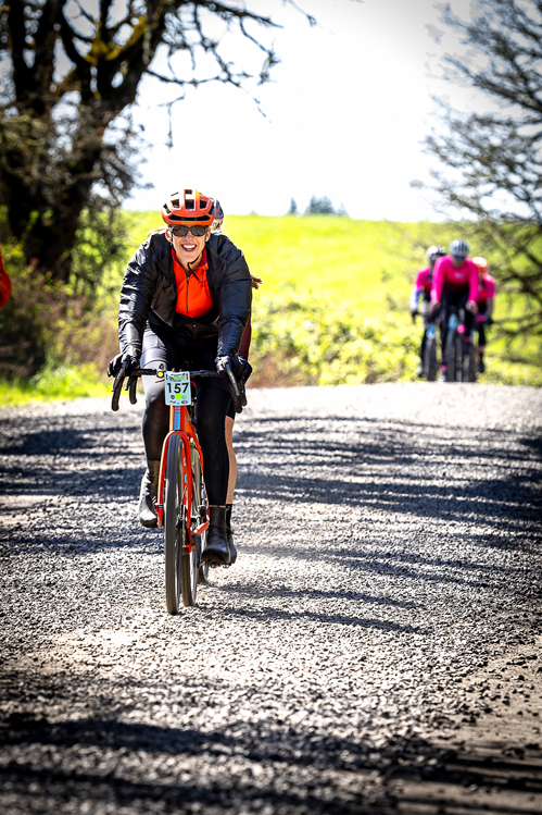 bicyclists ride on country road