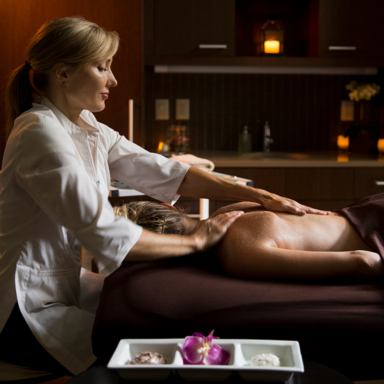 person receiving a massage in spa