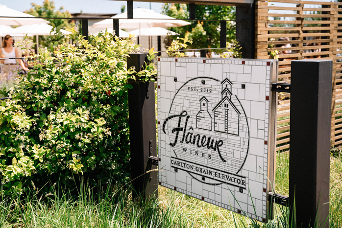 wooden sign with lettering for Flaneur Wines