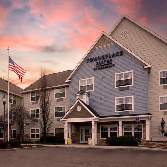 exterior of three story hotel building