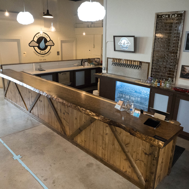 wooden bar with taps behind