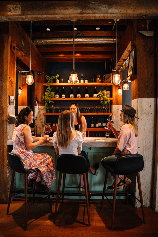 winery tasting room bar with three high stools