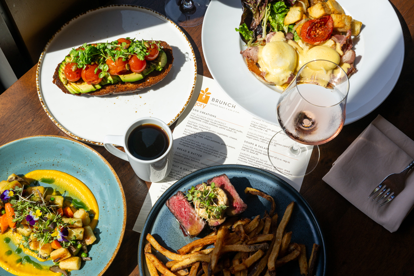 four entree plates with brunch dishes