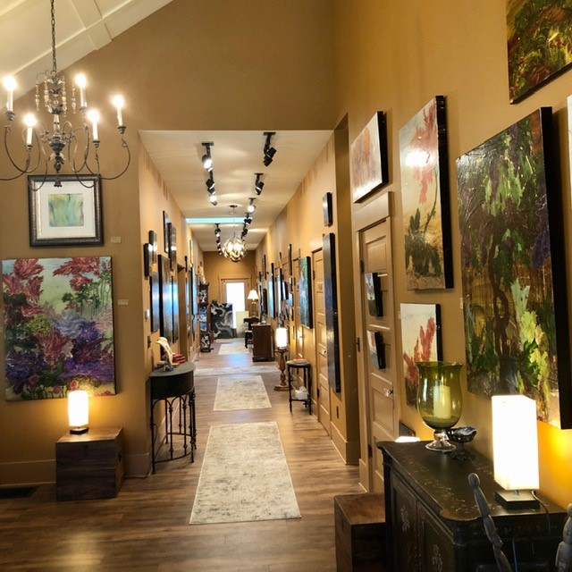 interior of gallery and retail space with art hanging on walls