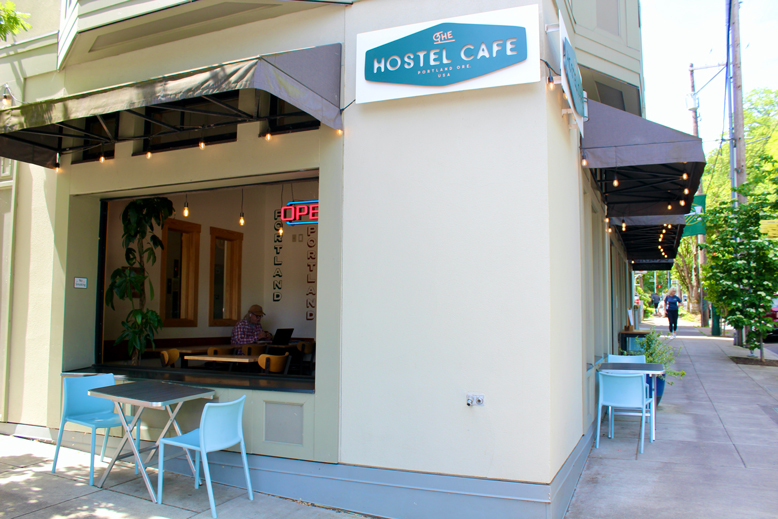 outdoor seating at a cafe on a corner