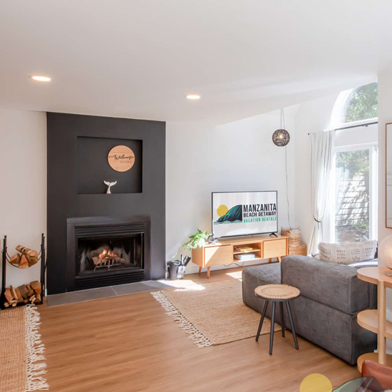 modern living room of beach vacation rental with fireplace
