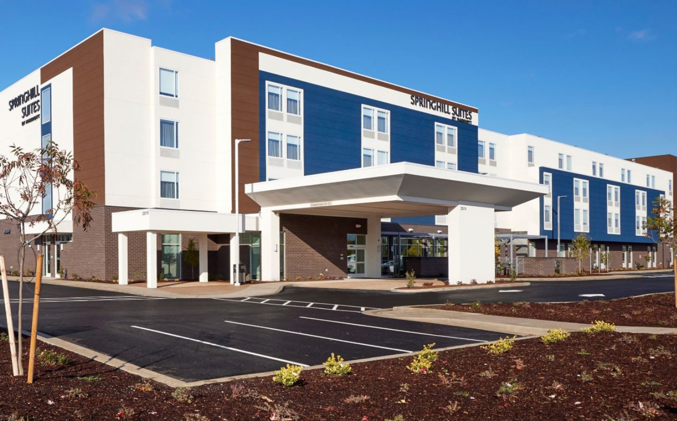 exterior of four story Springfield Suites hotel