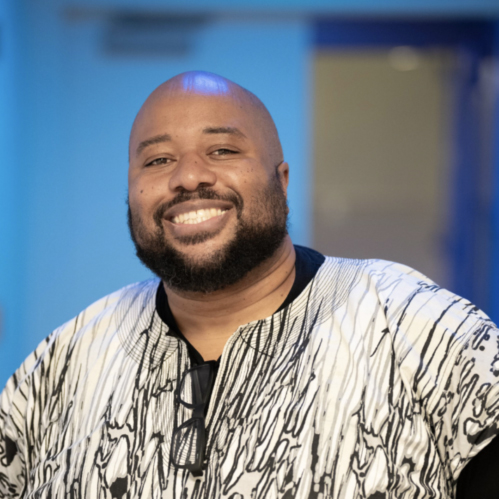 filmmaker Ime Etuk smiles at camera