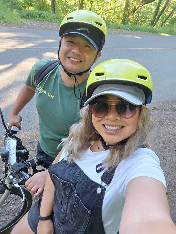 two people on eBikes pose for selfie