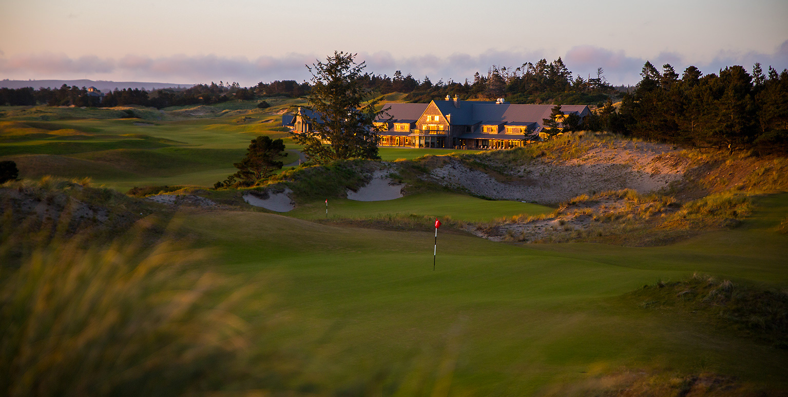 rugged golf course with lodge in background