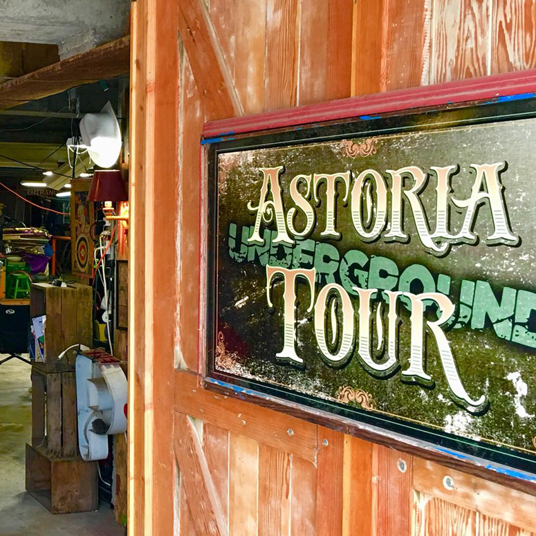 mirror sign with Astoria Tour spelled on it