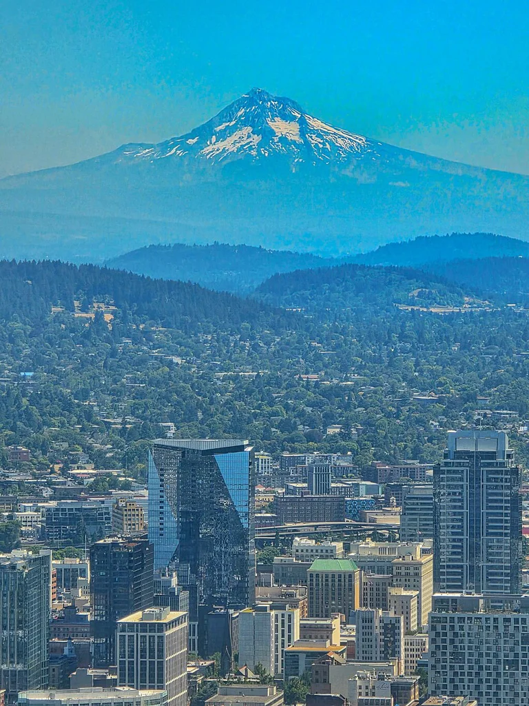 View of Mt Hood with Portland cityscape.