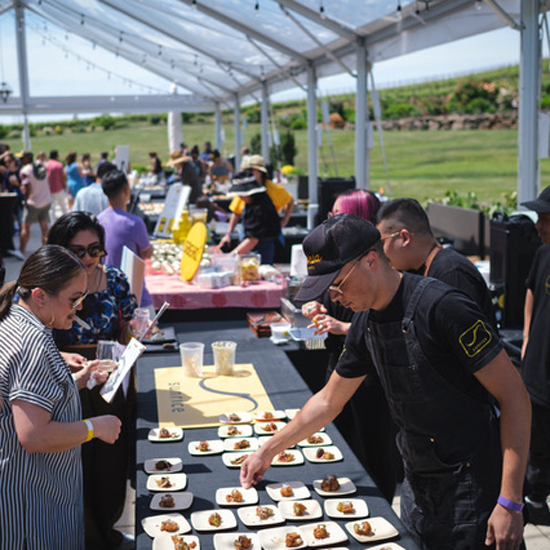 tables at a food and wine fest with vendors