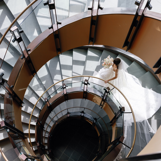 bride descends spiral staircase