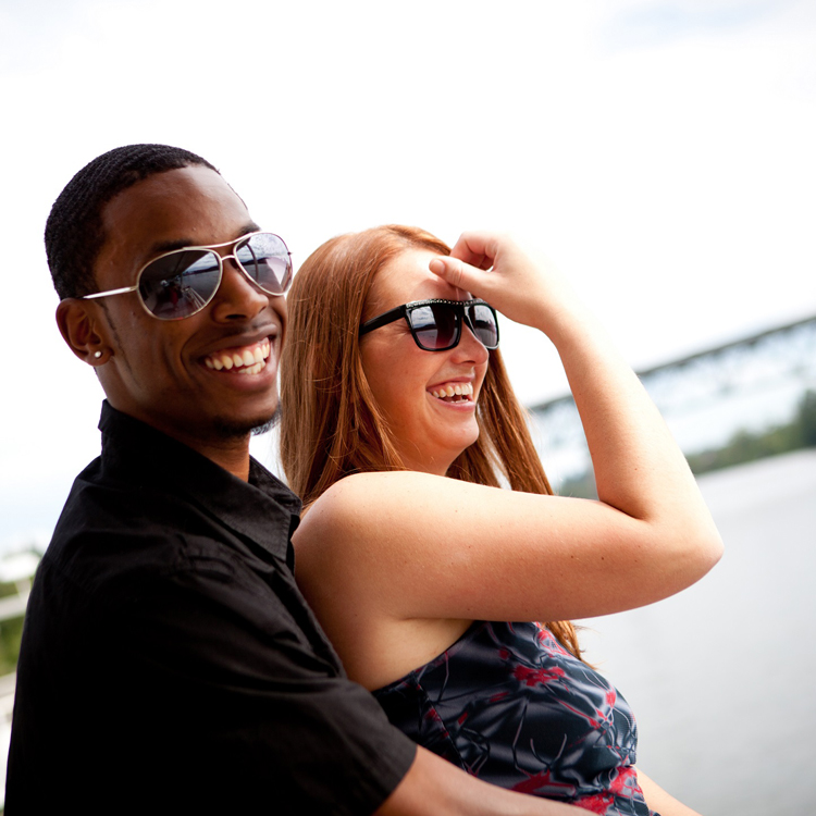 couple, both wearing sunglasses, smiling