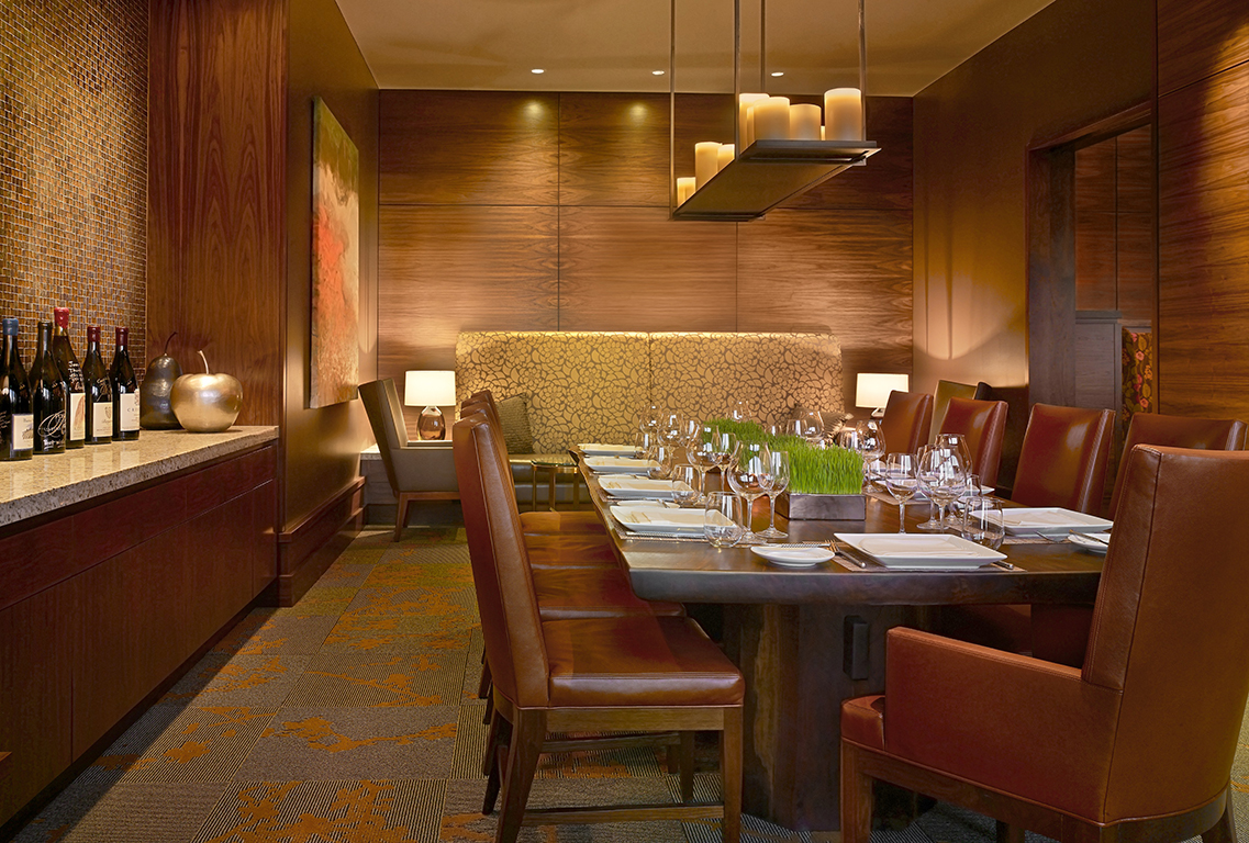 restaurant with banquet table and leather covered chairs