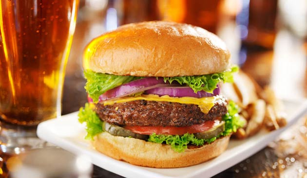 Cheeseburger with fries and beer.