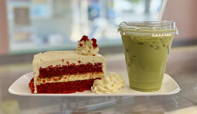 slice of red velvet cake and a glass of green juice
