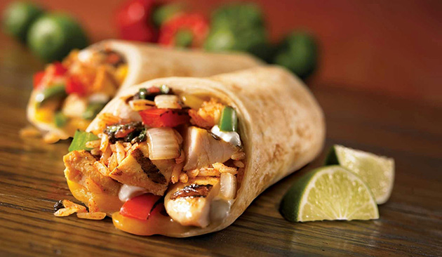 chicken burrito with fresh lime wedges