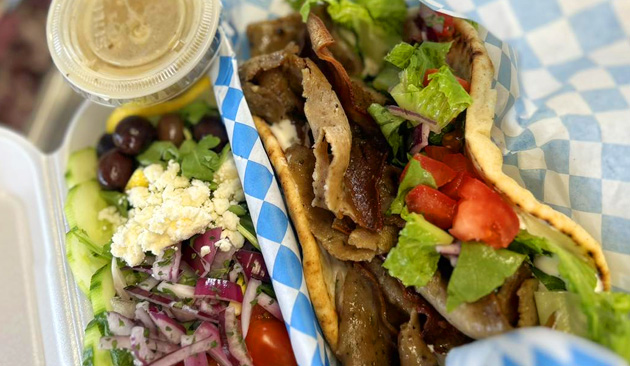 pita sandwich with mediterranean sides