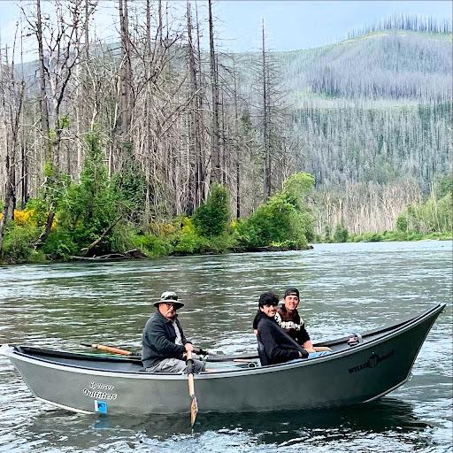 Three people in a row boat